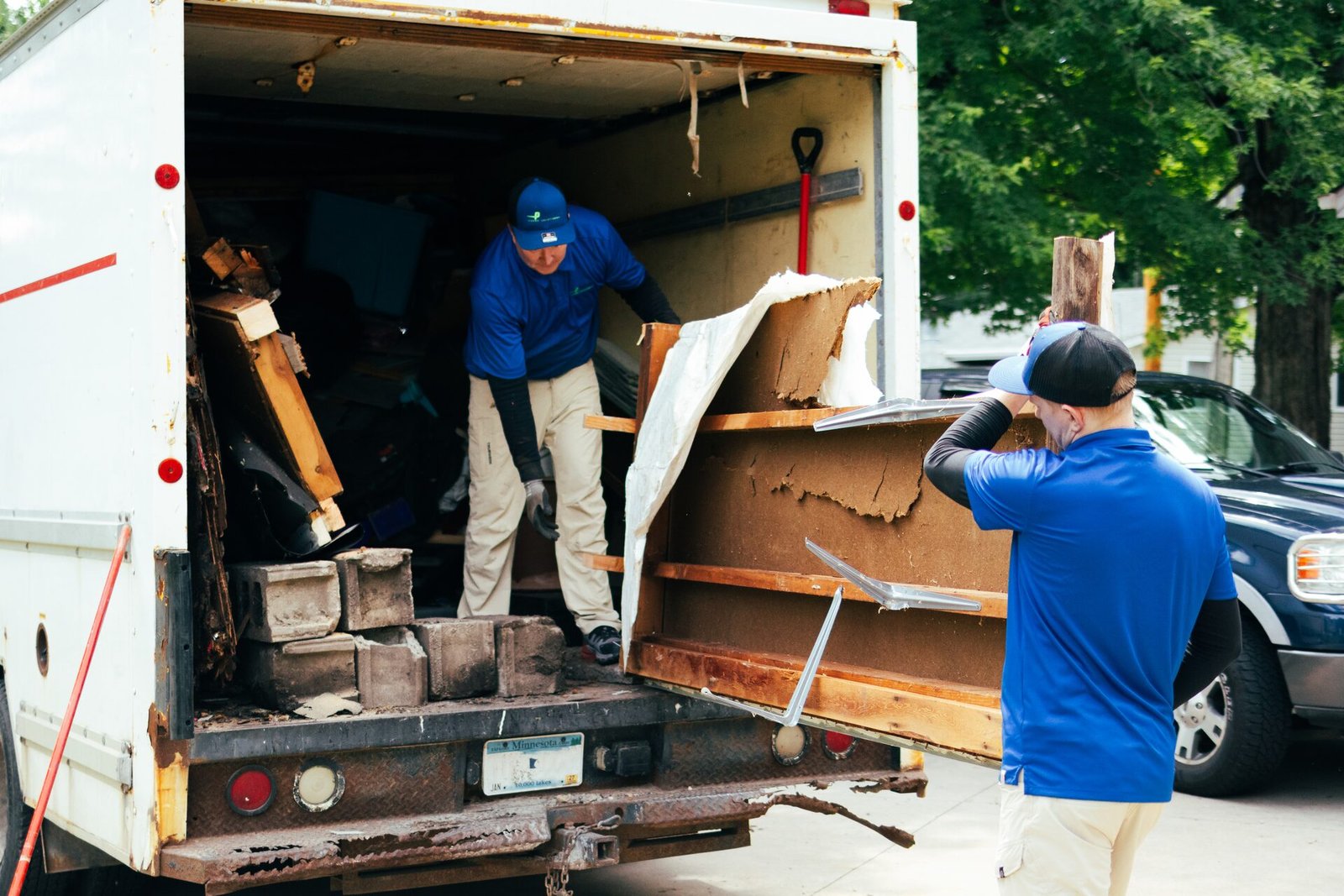 The AP Brothers crew loading a truck on a job