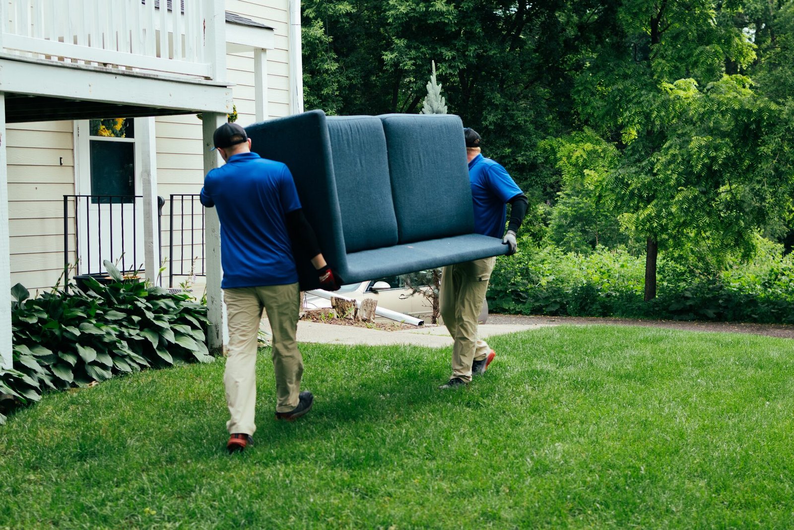 AP Brothers hauling furniture during a junk removal job